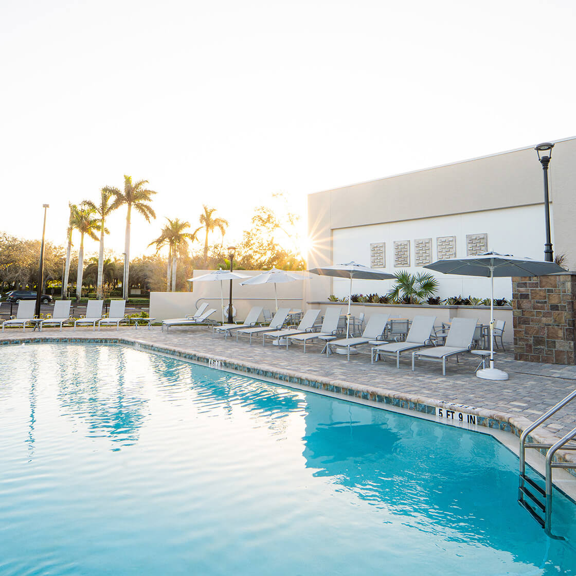 Club pool with patio furniture